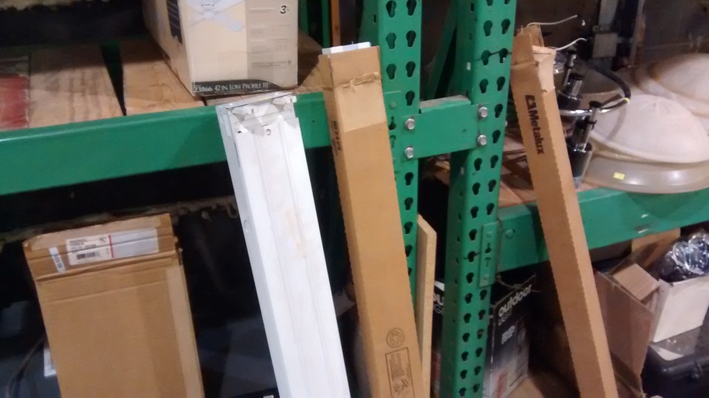 Florescent light fixtures still in their boxes at Recycle Ann Arbor