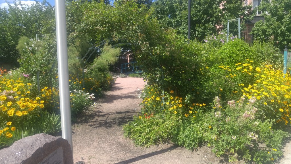 Vertical feature's like this arch over the pathway gives the illusion that the garden is larger than it actually is.