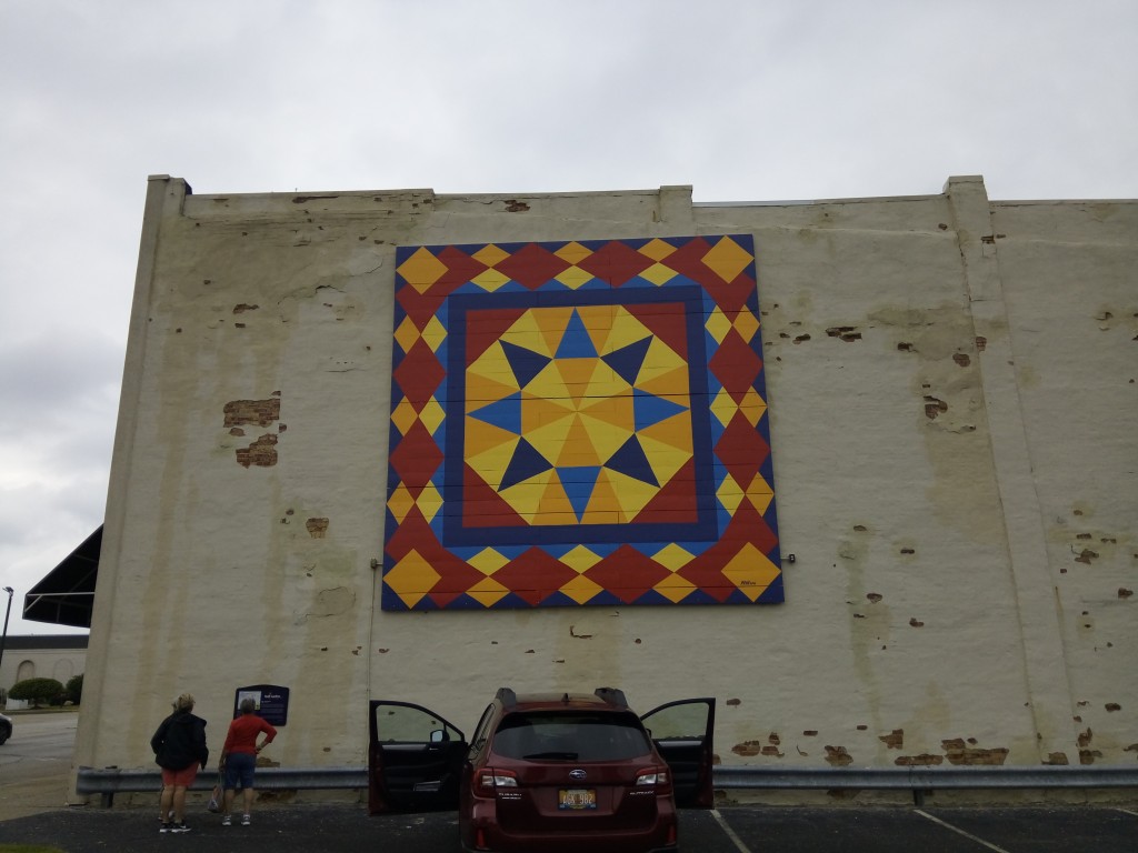 This large quilt mural dresses up an otherwise drab wall.