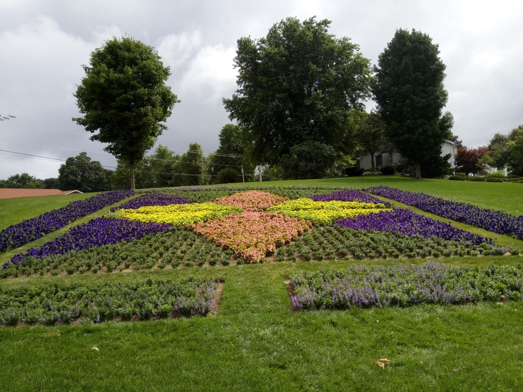 Vibrant flowers reproduce quilt patterns.